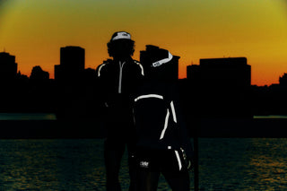 Reflective detail on running apparel catching a light source in the dark