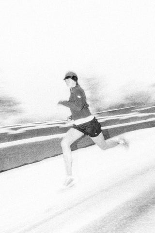 Runner in heavy snowfall, shot in black and white